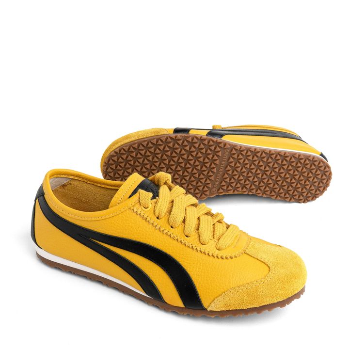 KANSAI_3-Tenis-Amarelo-Sola-Baixa-Tiras-laterais-Preto-1.jpg